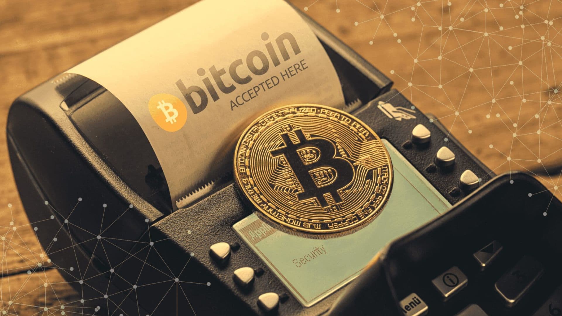 Bitcoins sendo usandos em uma máquina para representar que a moeda digital ganha cada vez mais poder de compra.